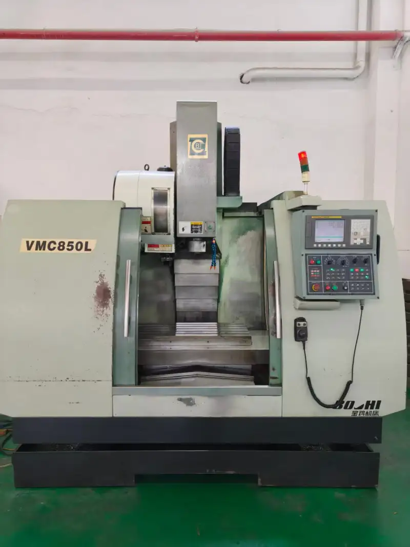 Used Baoji 850 Vertical Machining Center with Fanuc MD Control photo 1