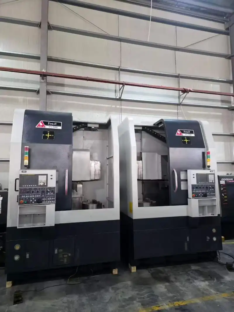 Two Identical You Ji 500 E CNC Vertical Lathes photo 1