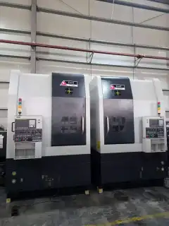 Two Identical You Ji 500 E CNC Vertical Lathes photo 2