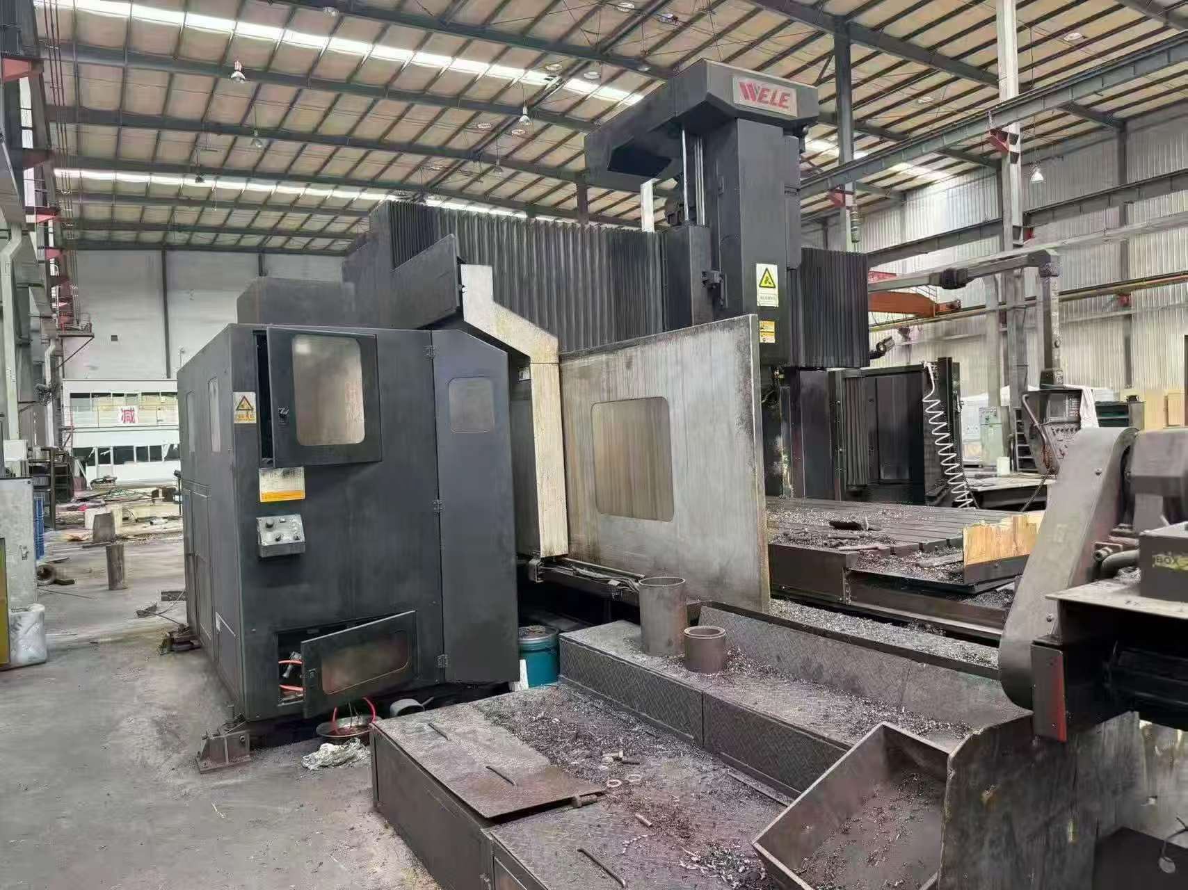 Used Taiwan Wei Li 4-Meter Gantry Milling Machine with Vertical/Horizontal Tool Magazine and Automatic Milling Head with Head Magazine photo 1