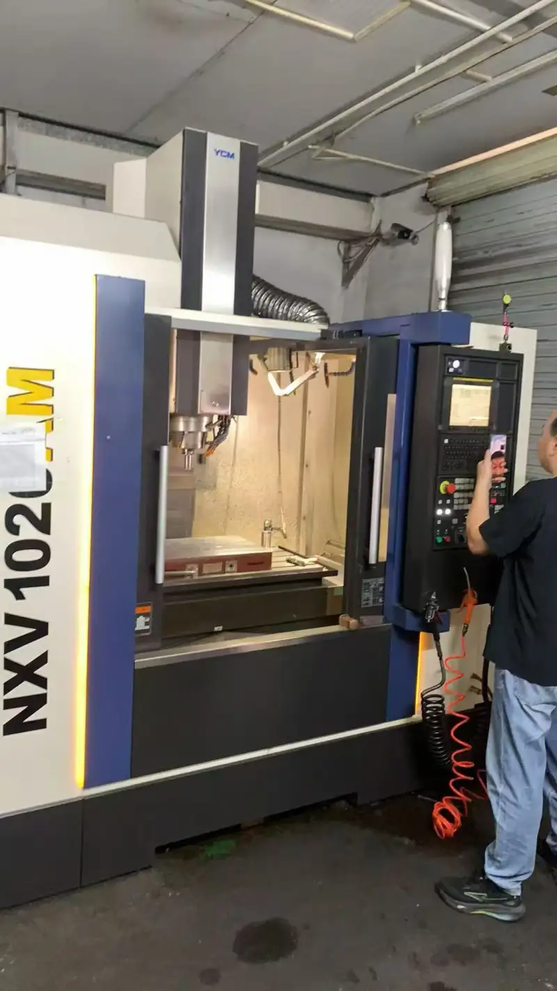 Used YCM NXV 1020 AM Vertical Machining Center with Fanuc Control photo 1