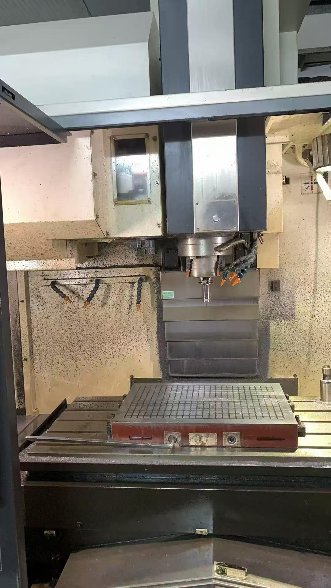 Used YCM NXV 1020 AM Vertical Machining Center with Fanuc Control photo 2