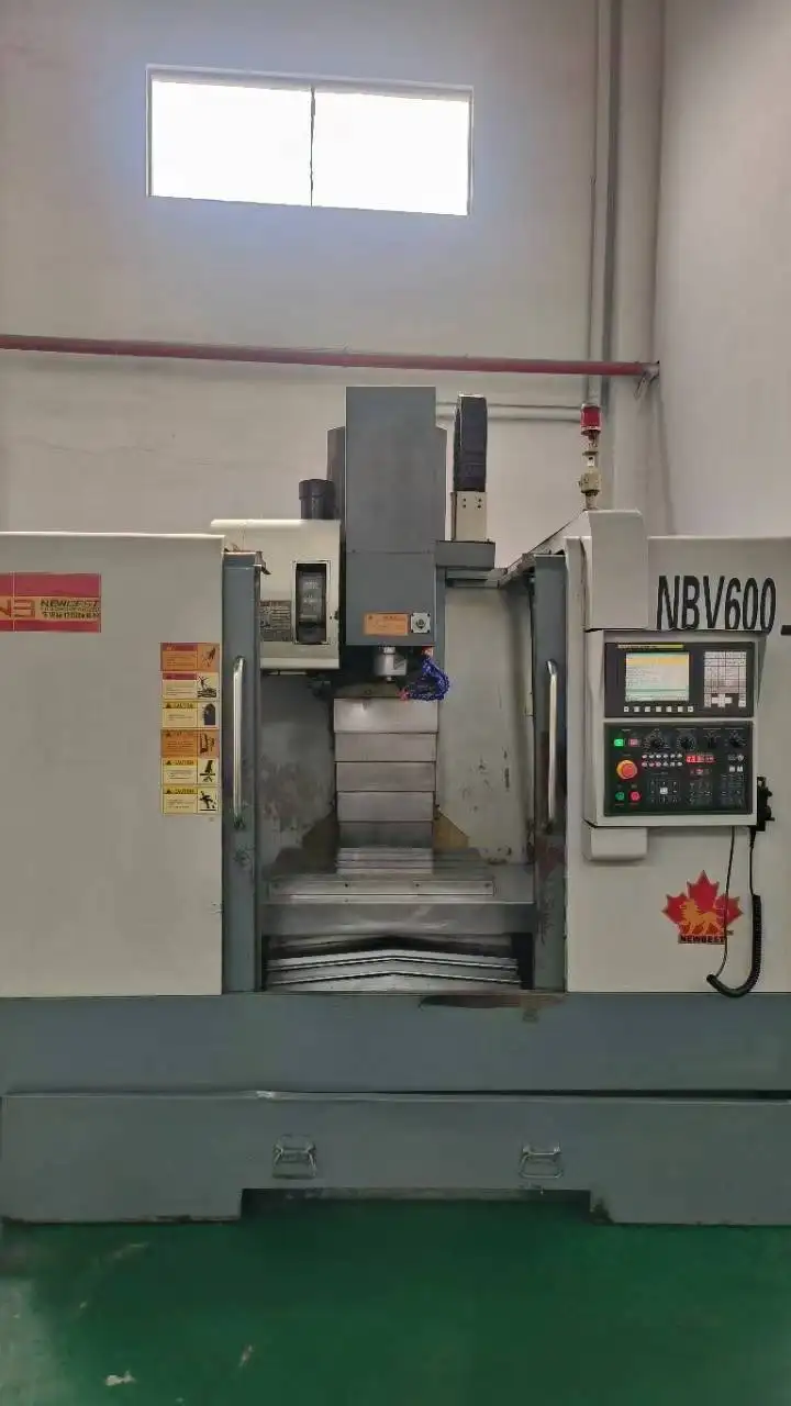 Used Nanjing Best 650 Vertical Machining Center with FANUC MD photo 1