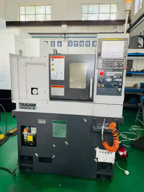 Torno CNC de torreta Tsugami M 06 J-2 usado con control FANUC TF Plus