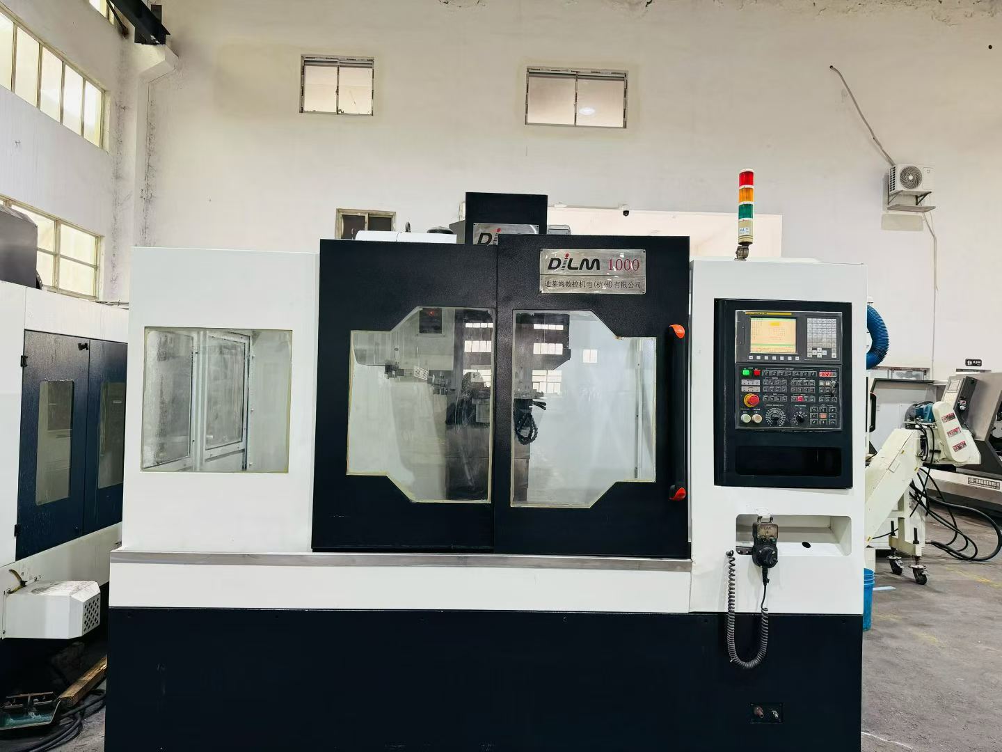 Used Dileimu 1060 Vertical Machining Center with Fanuc TD Control photo 1