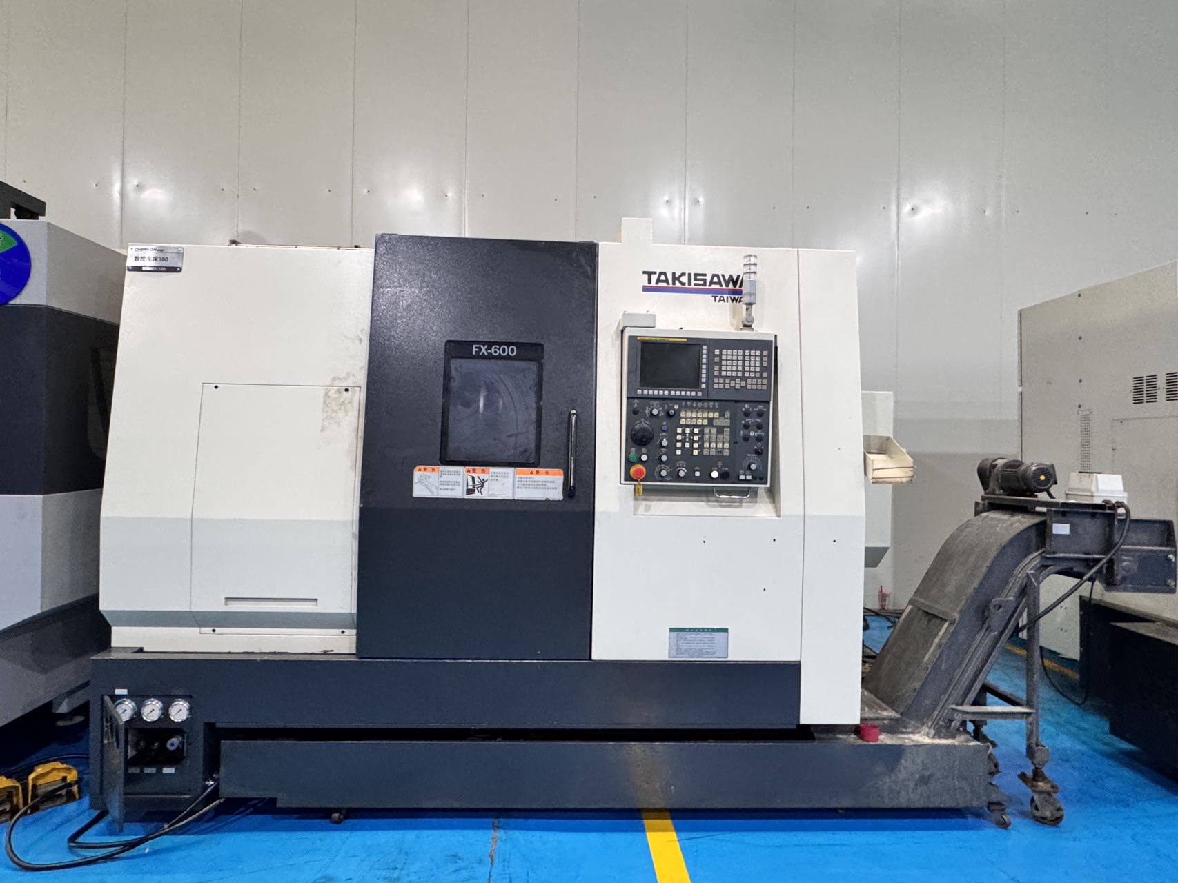 مخرطة CNC تاكيساوا FX-600 تيرن-ميل مستعملة مع مغزلين وبرجين