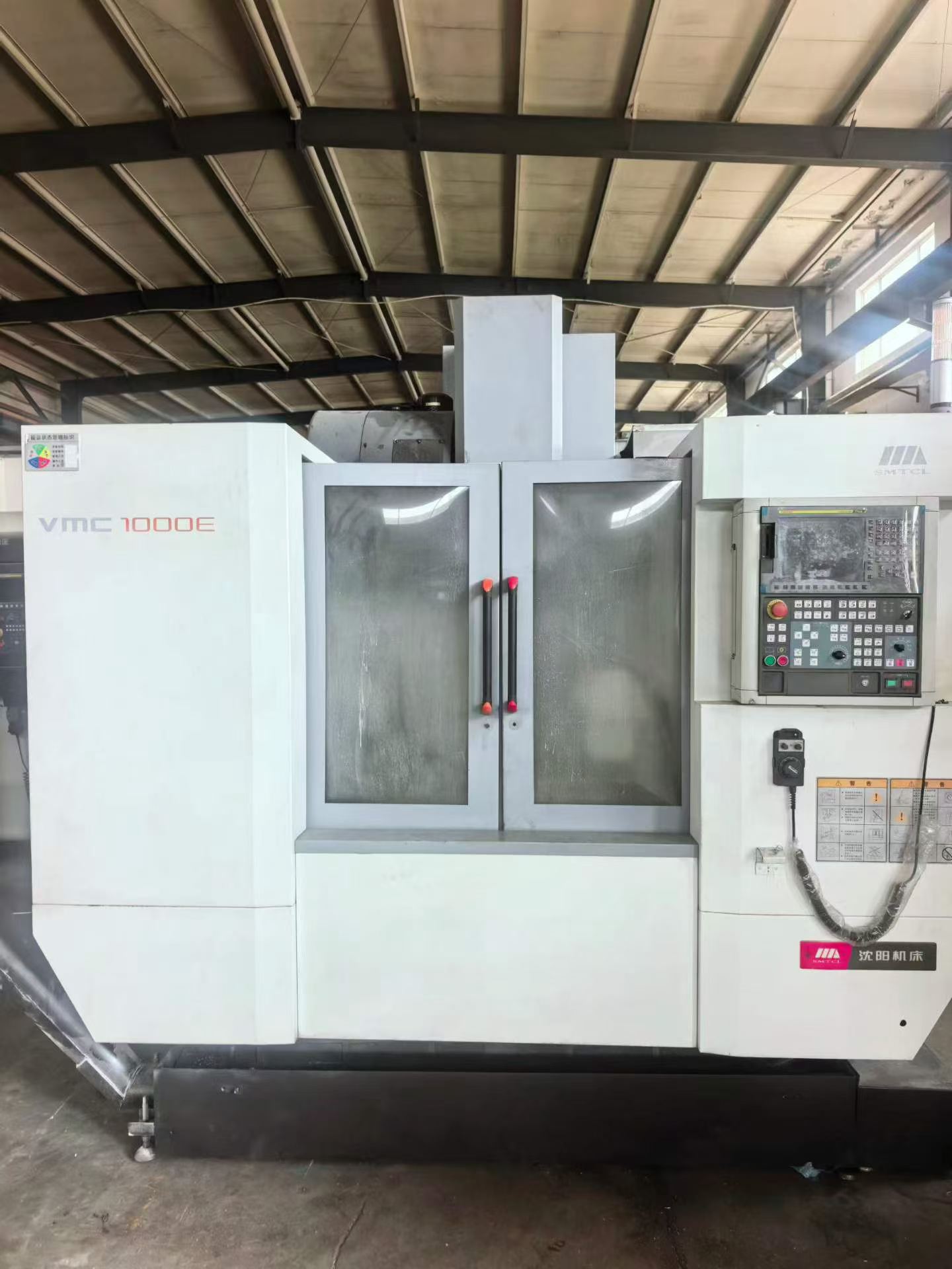 เครื่องแมชชีนนิ่งเซ็นเตอร์แนวตั้ง 4 แกน SMTCL Shenyang VMC 1000 E มือสอง พร้อม FANUC 0i-MF Plus