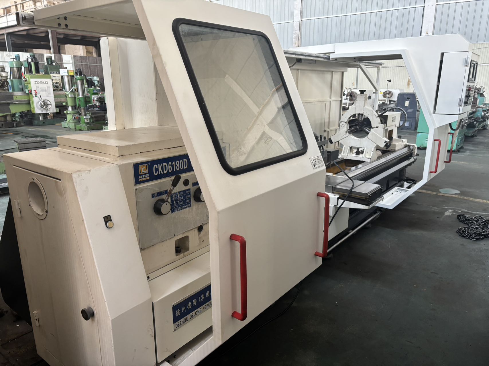 Torno horizontal CNC de servicio pesado Pulisen (PRECISION) CKD 6180 D usado con KND K 1000 TC 1i