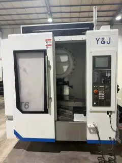 Used YUJIANG T 6 Vertical Drilling and Tapping Center with Mitsubishi M 80 photo 1