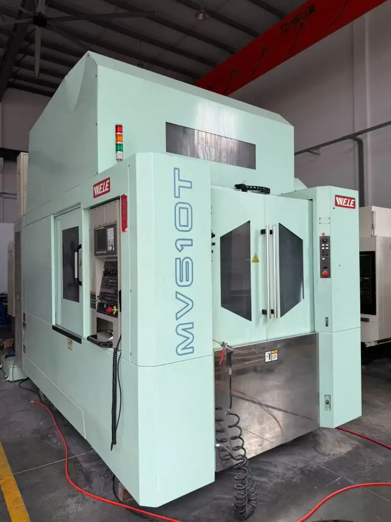Used WELE 610 Dual-Station Vertical Machining Center with FANUC MD Control photo 1