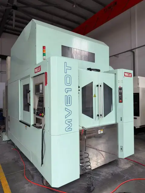 Centro de mecanizado vertical de dos estaciones WELE 610 usado con control FANUC MD